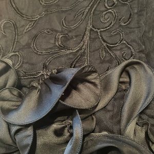 Black evening dress with lace flower design.  Black rose ruffle and fully lined.